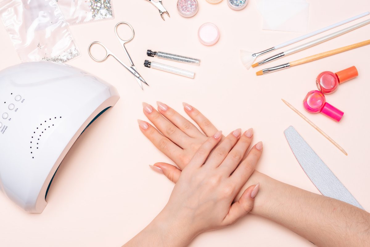 girl's hands background of manicure accessories. close up