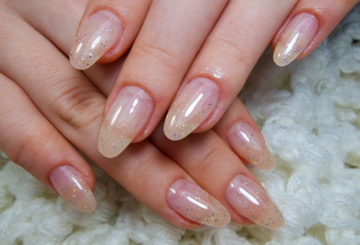 2025 Nail Color Trends.. A close-up of a professional modern gel manicure