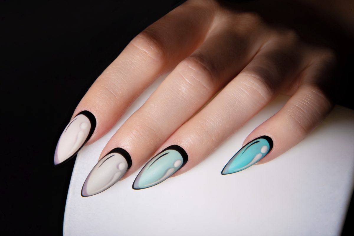 Female hands with pop art style manicures. Creative nail art. . High-quality photo