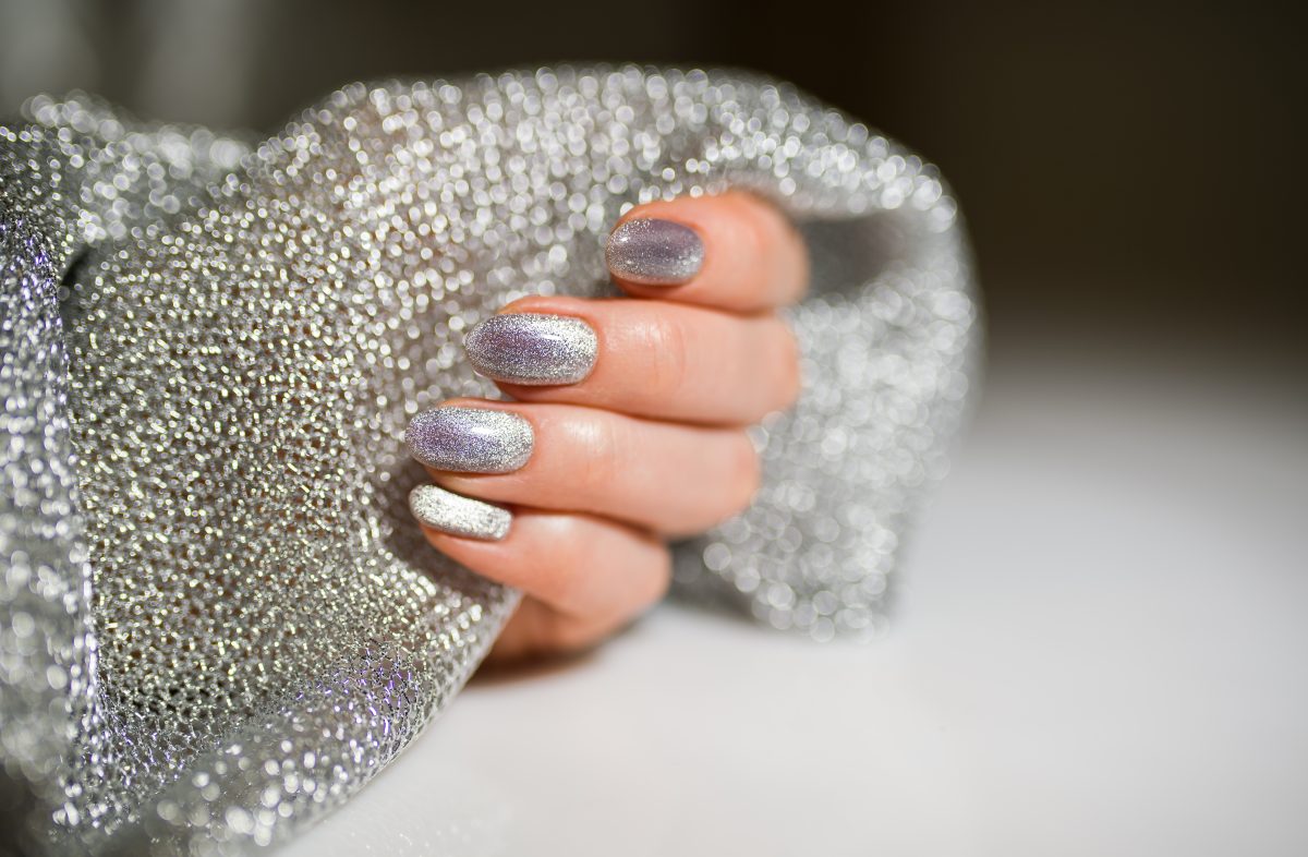 Nails Design. Hands With Bright Silver Christmas Manicure. Close Up Of Female Hands. Art Nail. 2025 Nail Color Trends.