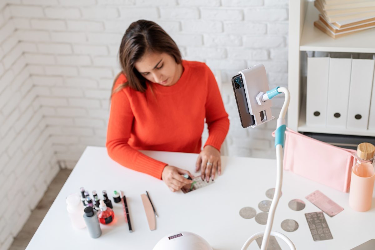 A woman is working to open home-based nail business. Home nail salon. Nail tools. Nail technician working from home.